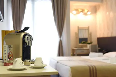 a hotel room with a table with a machine on it at Zepter Spa Wellness Hotel & Zepterme member of Zepter Hotels in Vrnjačka Banja