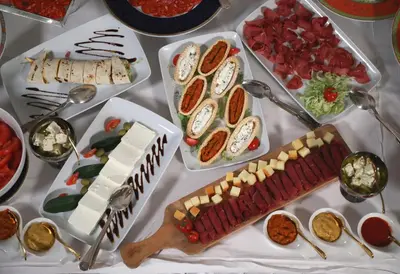 a table topped with different types of food with spoons at Zepter Spa Wellness Hotel & Zepterme member of Zepter Hotels in Vrnjačka Banja