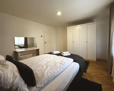 a bedroom with a bed and a television in it at Apartments Velickovic in Soko Banja