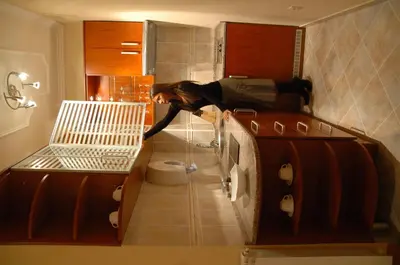 a woman laying on the floor in a bathroom at Hotel Tehnograd in Kraljevo