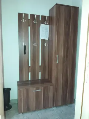 a row of wooden cabinets in a room at Studio S Sokobanja in Soko Banja
