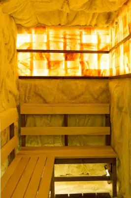 a wooden bench in a room with a window at B&B Nataly 2 in Soko Banja