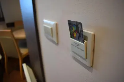 a switch on a wall with a box on it at Apartment Maja Konaci in Kopaonik