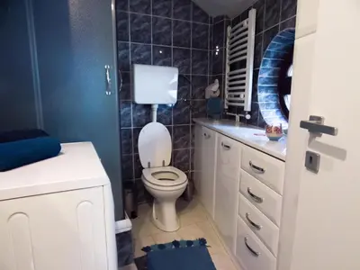 a bathroom with a toilet and a sink at Apartment Niš Center in Niš