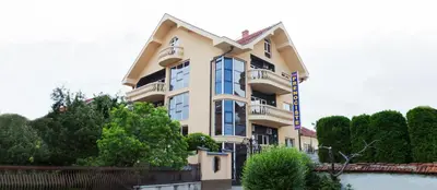 a large building with a lot of windows at Prenoćište Kovač in Vranje