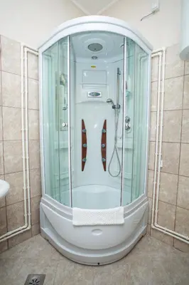 a shower with a glass enclosure in a bathroom at Sin-Kom Hotel Garni in Pirot