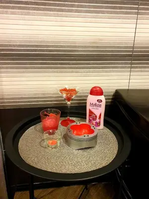 a small table with a blender and a drink at Ceca Apartman in Niš