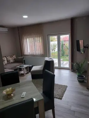 a living room with a couch and a table at Apartmani Radulović in Vrnjačka Banja
