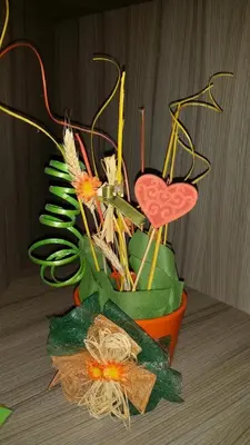 a vase filled with different types of plants at Apartman Ristic in Niška Banja