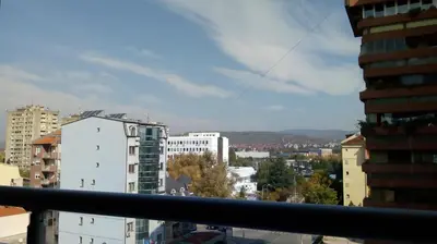 a view of a city from a balcony at Naissa Apartment in Niš