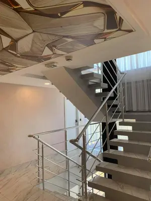 a spiral staircase in a building with a ceiling at Hotel 