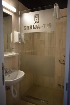 a bathroom with a sink and a shower at Hotel 