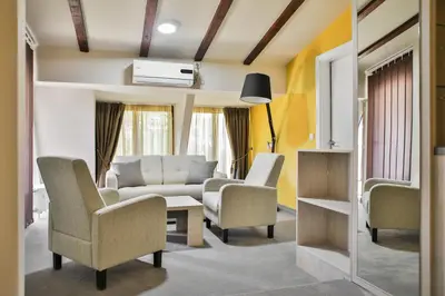 a living room with a couch and chairs at Harmony Bed and Breakfast in Vranje