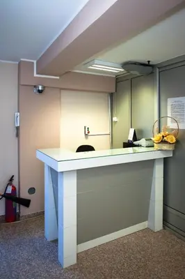a room with a white counter with a mirror at Guesthouse Vitez in Vranje