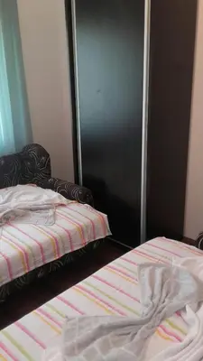 two beds sitting next to each other in a bedroom at Apartment Pavlovic in Soko Banja