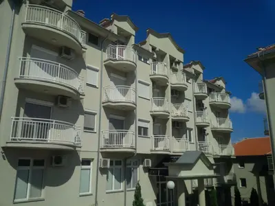 a tall building with balconies on the side of it at Studio Pinos in Soko Banja