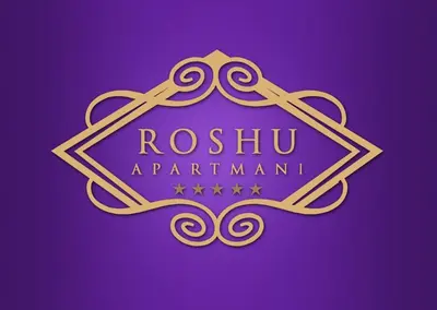 a purple and gold logo with a royal warrant at Apartmani 