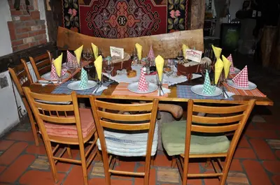 a table with party hats on top of it at Inn Cakmara in Raška
