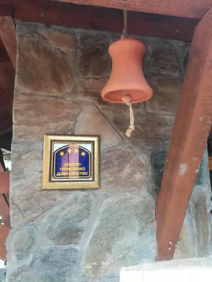 a picture on a stone wall with a light and a lamp at Seosko turističko domacinstvo Imunsan in Niš