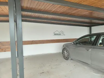 a car parked inside of a garage at Seosko turističko domacinstvo Imunsan in Niš