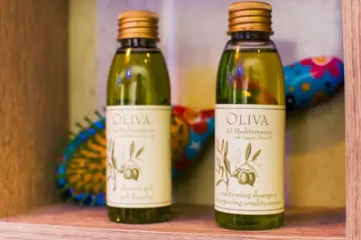 two bottles of wine sitting on a shelf at Apartment Aleksija in Niš