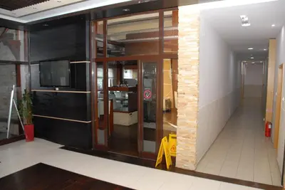 an entrance to a building with glass doors at Apartments Mitic in Kopaonik