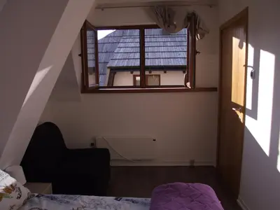 a bedroom with a window and a bed in a room at Apartments Mitic in Kopaonik