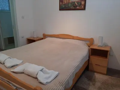 a bedroom with a bed with towels on it at Vikendica RTANJ in Rtanj