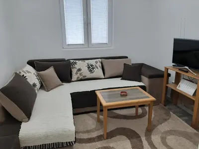 a living room with a couch and a coffee table at Vikendica RTANJ in Rtanj