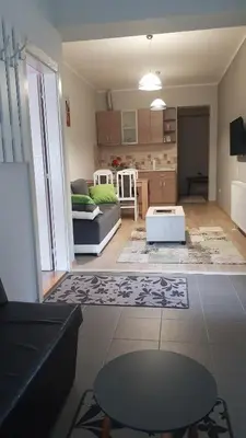 a living room with a couch and a table at Apartmani V&F in Vrnjačka Banja