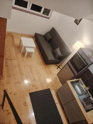 an overhead view of a living room with a couch and a table at Studio Apartman Lenka in Soko Banja