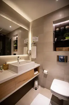 a bathroom with a sink and a toilet at Hotel Putnik Kopaonik in Kopaonik