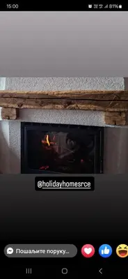 a screenshot of a fireplace on a website at Apartments Holiday Home Srce in Kopaonik