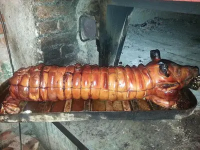 a large lobster is cooking on a grill at Kuca za odmor ''Djurovic'' in Kopaonik