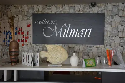 a table with a sign that reads wellness millennium at K23 apartment Milmari in Kopaonik