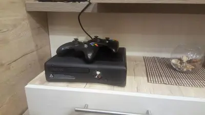 a video game controller sitting on top of a box at K22 Apartment Milmari in Kopaonik