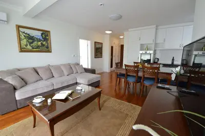 a living room with a couch and a table at Vila Opera in Vrnjačka Banja