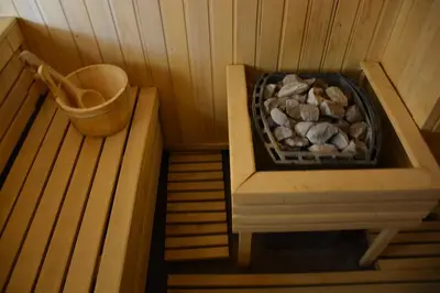 a inside of a sauna with a pile of rocks at Ski & Spa K2 Milmari Resort Lux in Kopaonik
