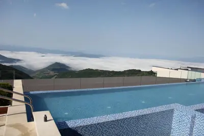 a swimming pool with a view of the mountains at Ski & Spa K2 Milmari Resort Lux in Kopaonik