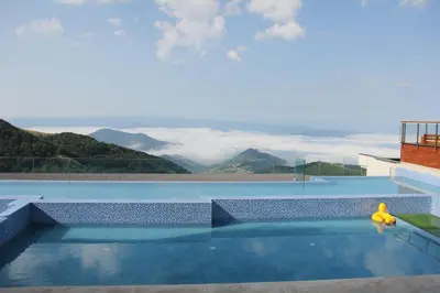 a swimming pool with a view of mountains at Ski & Spa K2 Milmari Resort Lux in Kopaonik