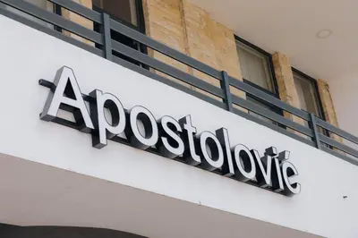 a sign on the side of a building at Apostolovic Plus in Leskovac