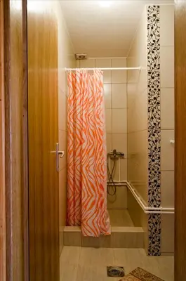 a bathroom with a zebra shower curtain at Apartmani Maja Sokobanja in Soko Banja