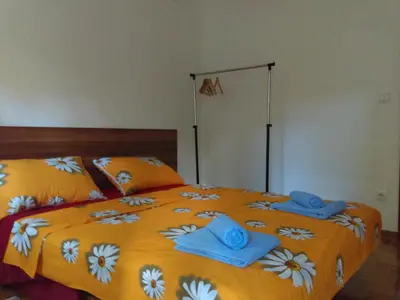 a bedroom with a bed with towels on it at Apartment Blagojevic in Vrnjačka Banja