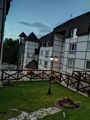 a building with a street light in front of it at Apartman 33 Kraljevi Čardaci in Kopaonik