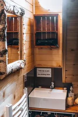 a bathroom with a sink and a mirror at Apartman Pustolov - Stara planina in Crni Vrh