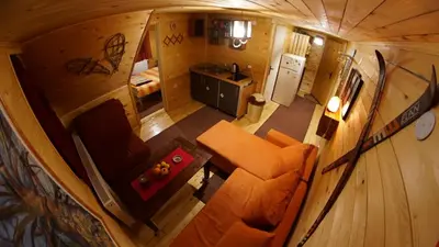 an overhead view of a living room and kitchen in a tiny house at Apartman Pustolov - Stara planina in Crni Vrh