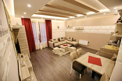a living room with a couch and a table at Astoria Lux - K16 Milmari in Kopaonik