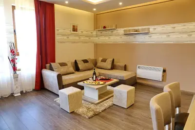 a living room with a couch and a table at Astoria Lux - K16 Milmari in Kopaonik