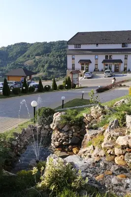 a water fountain in front of a building at Astoria Lux - K16 Milmari in Kopaonik
