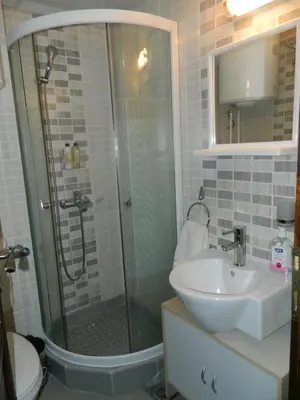 a bathroom with a shower and a sink at Apartment Sofi Yeti in Kopaonik